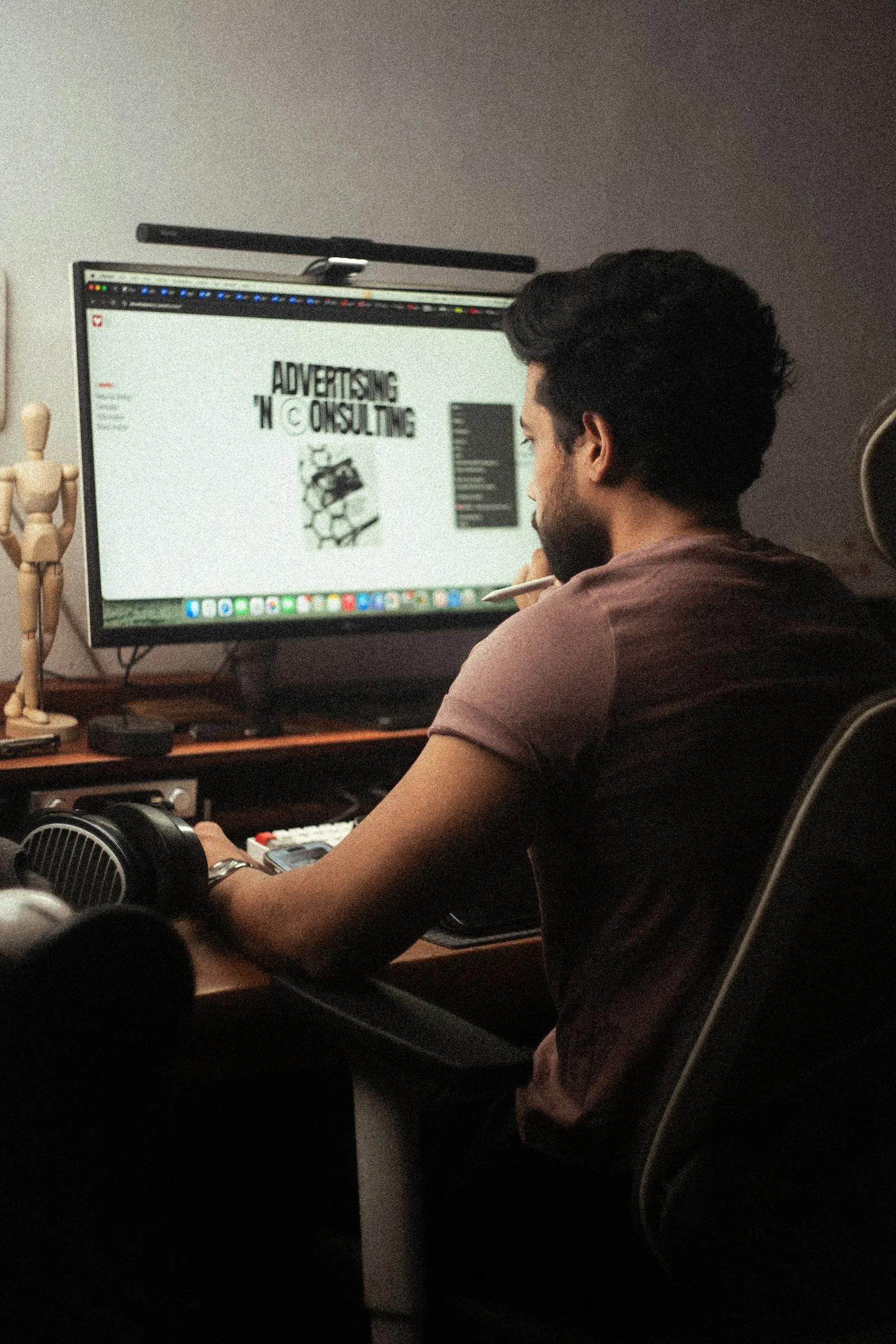 Designer working on a website at a monitor