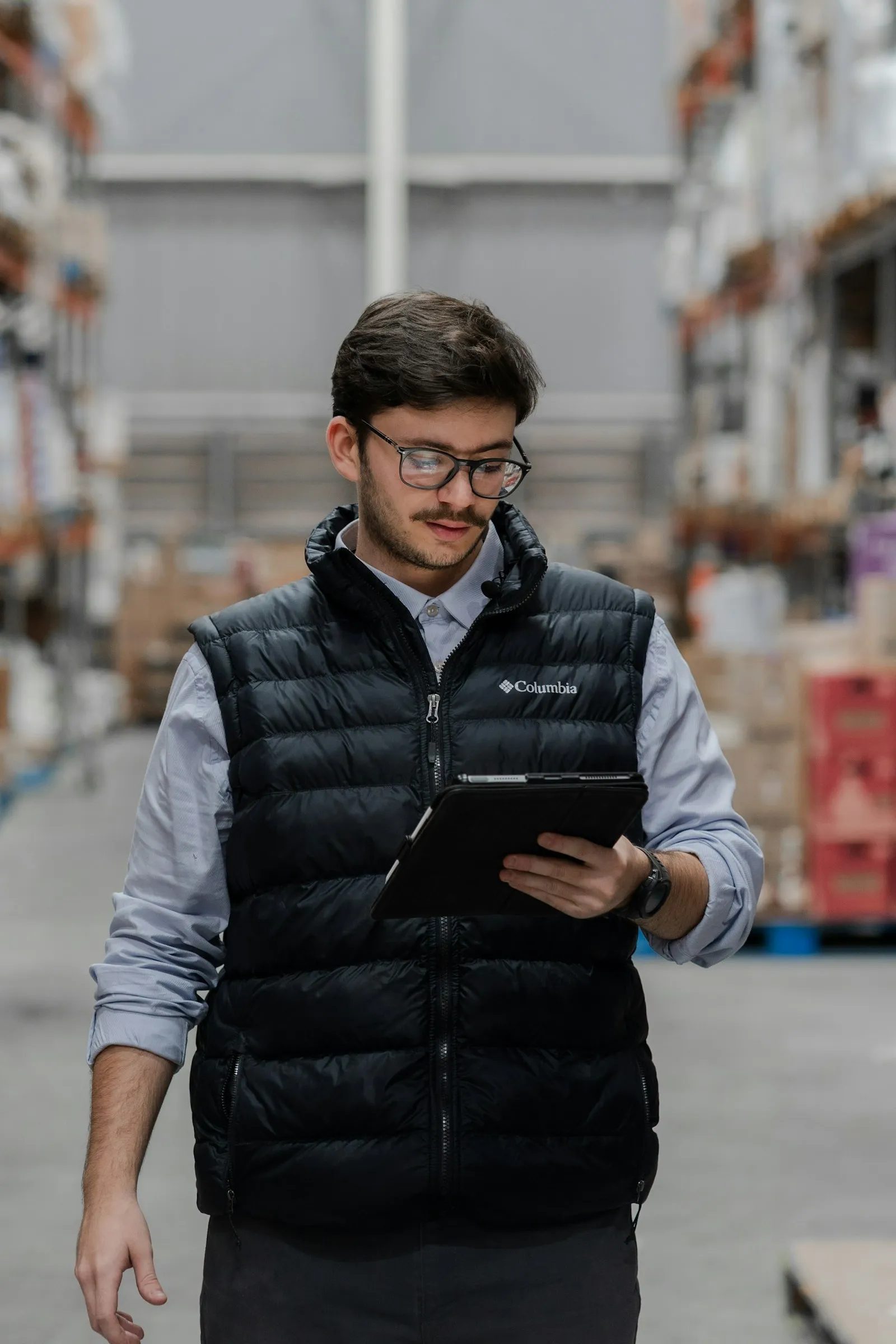 Warehouse worker checking orders on a tablet