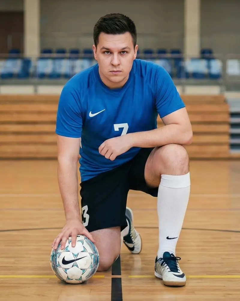Piotr Dejneka in a soccer kit in a sports hall